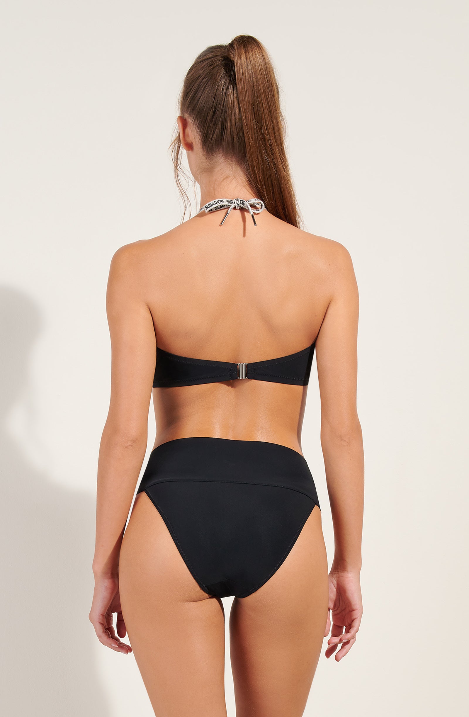 calio black covering bikini bottoms with lacing