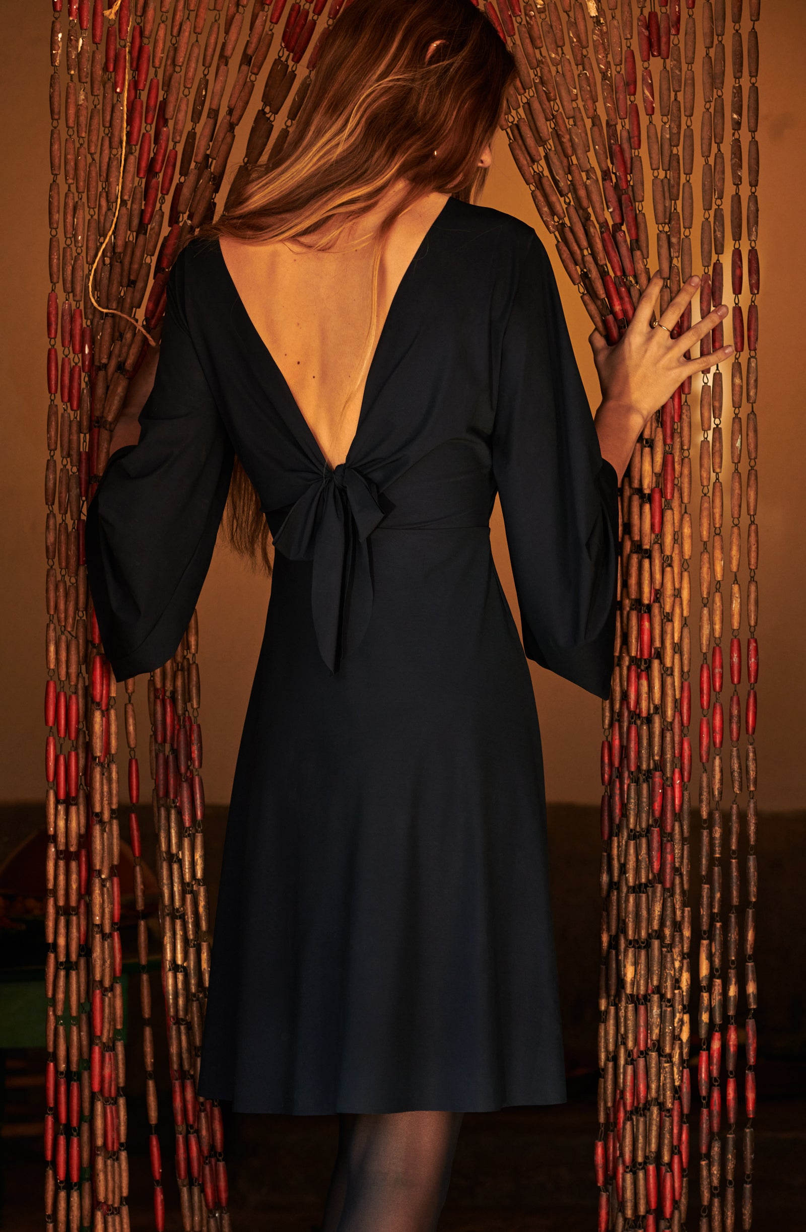 corey
Short black dress with long sleeves